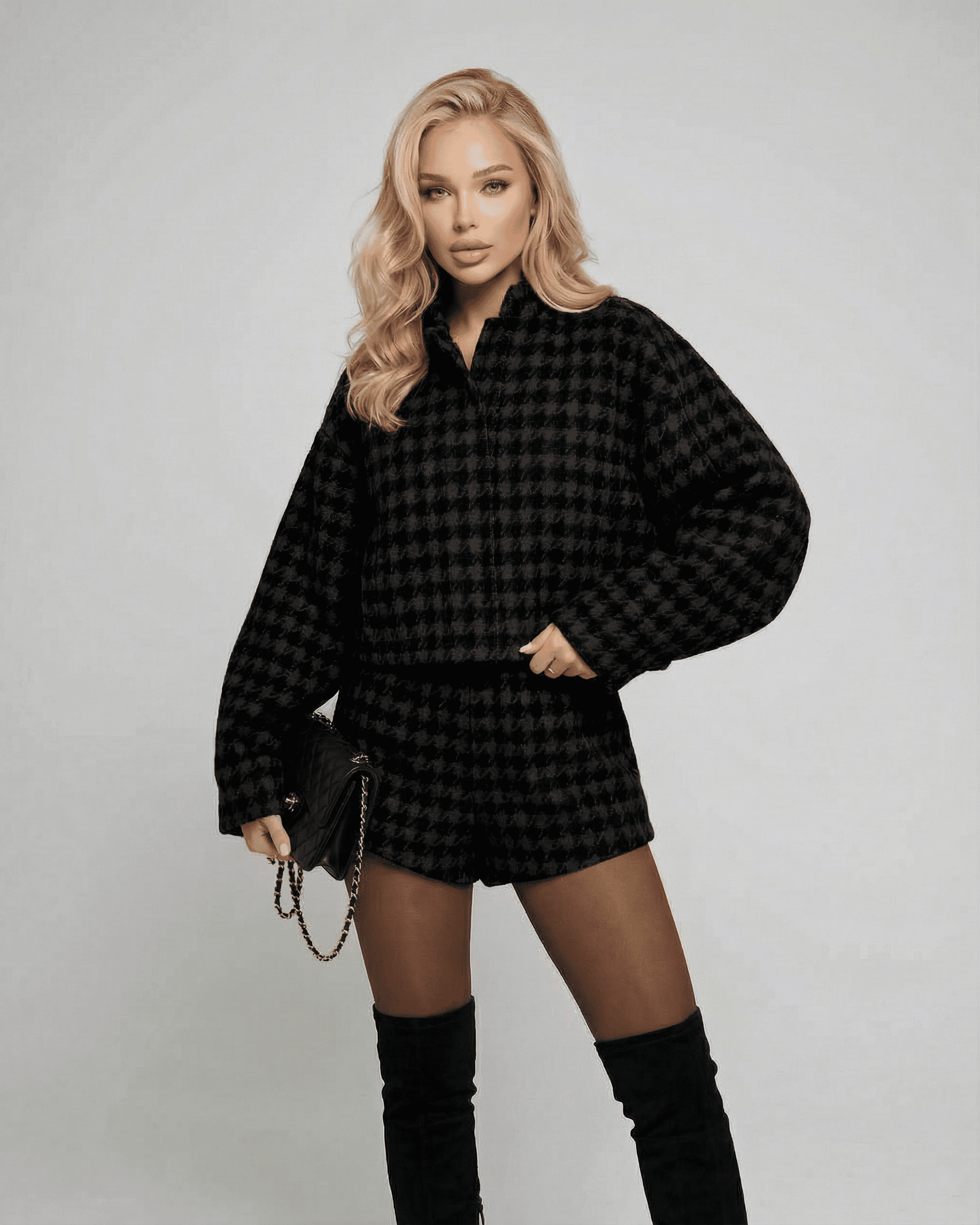 Elegant Noir Set by Slimona featuring tailored shorts and a structured long-sleeve top for a chic look.