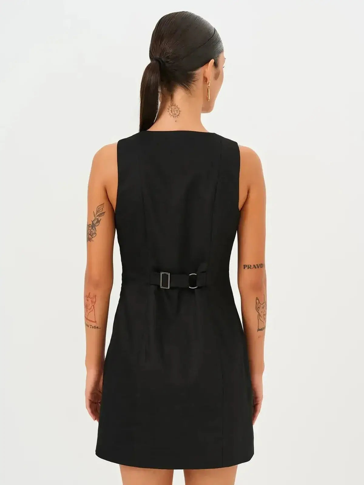 Back view of the Icon Edge Mini Dress showcasing its sleek design and structural details for women.