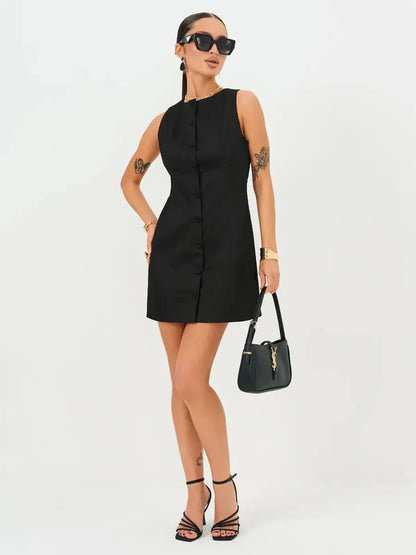 Elegant black mini dress with button detail, ideal for summer weddings, parties, or formal occasions.