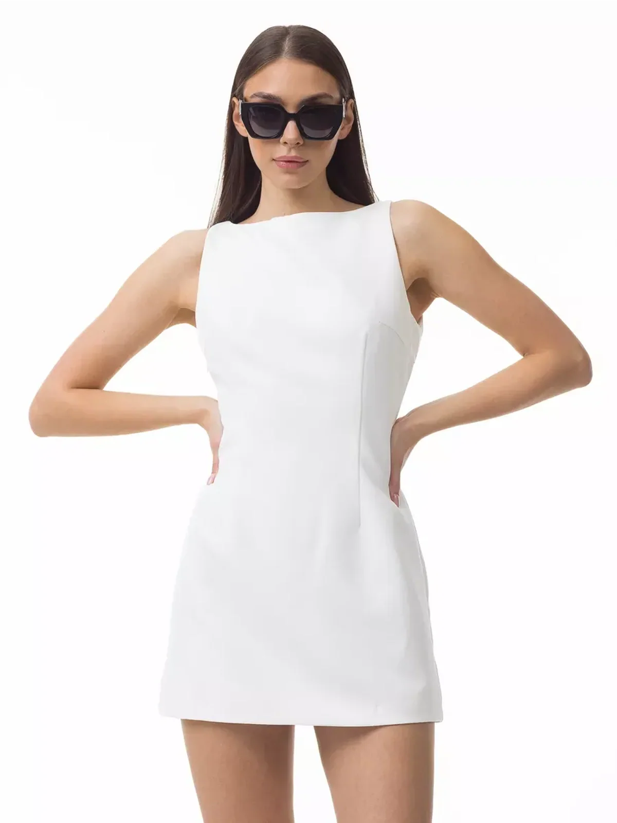Model wearing Iconic Curve Mini Dress, a stylish white body-hugging dress, perfect for summer and formal occasions.