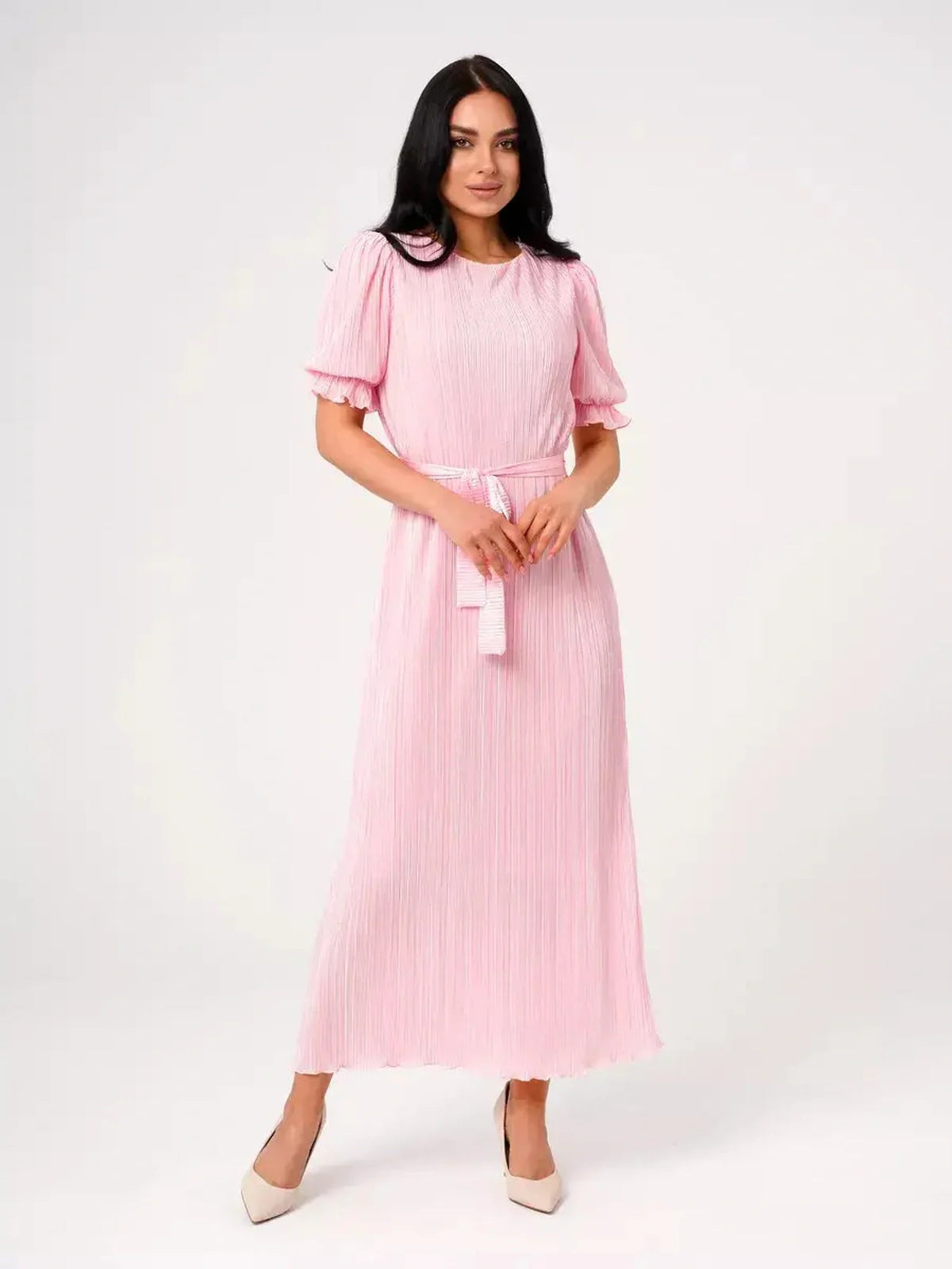 Celeste Maxi Dress in soft pink, featuring pleated design, puff sleeves, and tie waist, perfect for summer events.