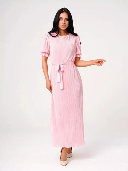 Celeste Maxi Dress in soft pink with pleated design, puff sleeves, and waist tie, perfect for weddings and summer events.