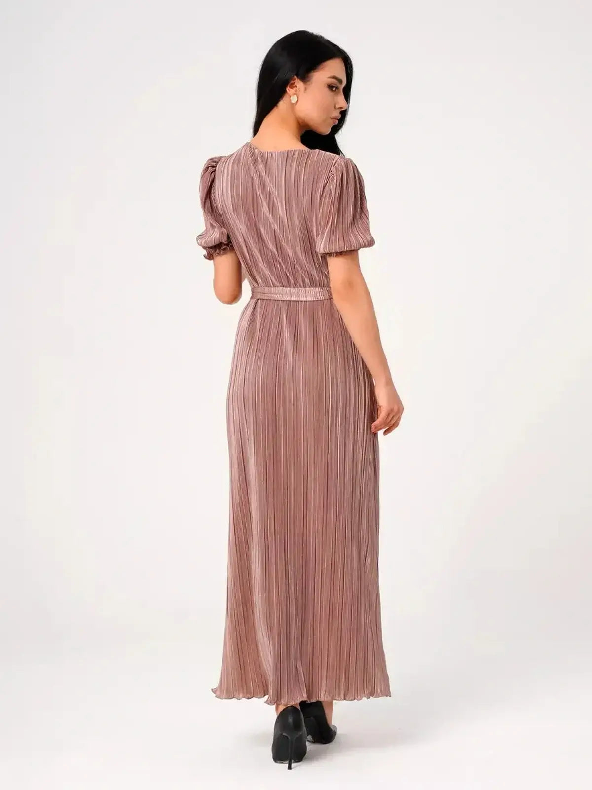 Back view of the Celeste Maxi Dress featuring elegant pleats and puff sleeves in light cappuccino hue.