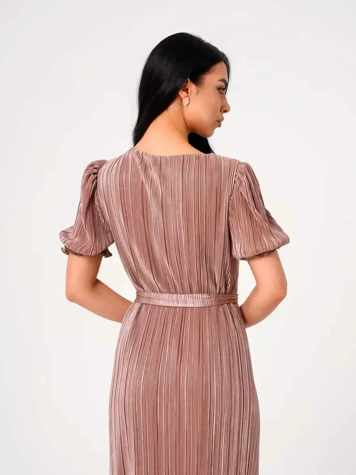Back view of the Celeste Maxi Dress showcasing elegant pleats and puff sleeves in soft cappuccino hue.