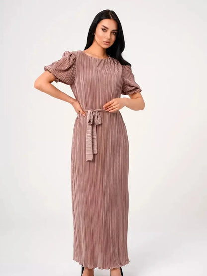 Celeste Maxi Dress in soft cappuccino with pleats and puff sleeves, perfect for weddings or formal events.