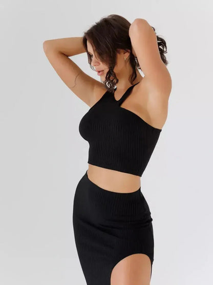 Sculpted Edge Set featuring a one-shoulder crop top and high-waisted skirt, perfect for wedding guest or cocktail occasions.