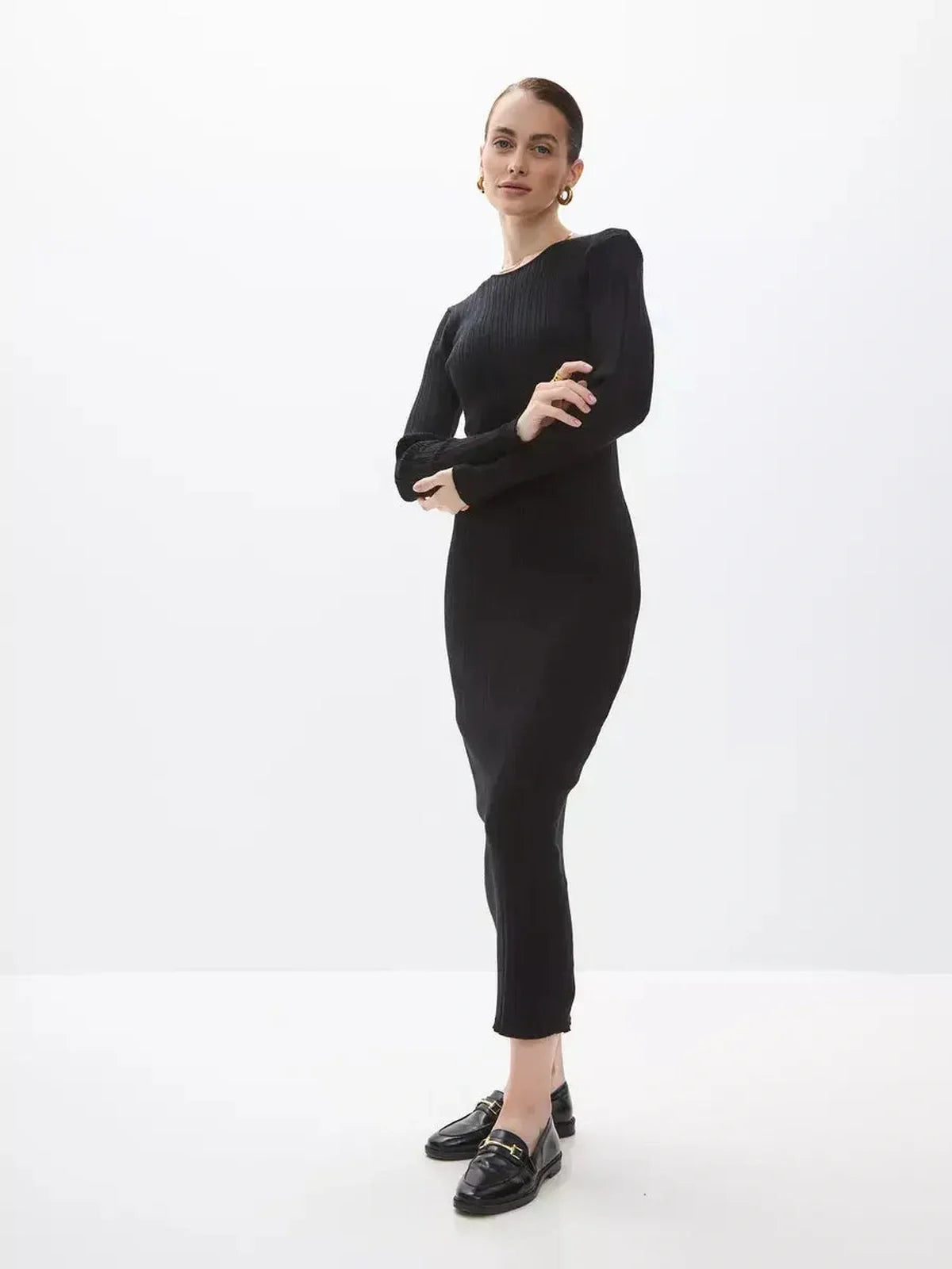 Sculpted Rib Maxi Dress in black featuring a streamlined silhouette, perfect for formal and casual occasions.