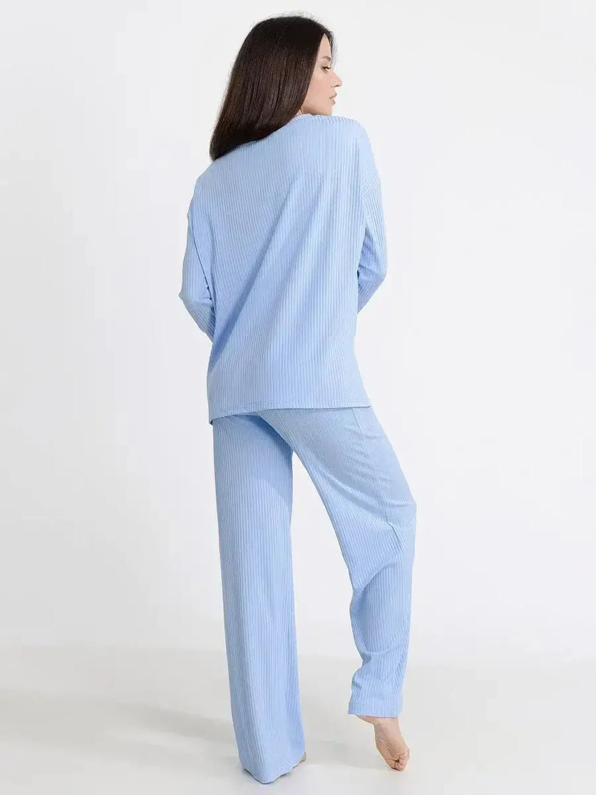 Model wearing the Cloudline Lounge Set in light blue, showcasing its relaxed fit and soft ribbed knit design.