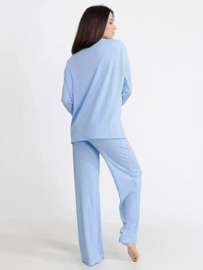 Model wearing the Cloudline Lounge Set in light blue, showcasing its relaxed fit and soft ribbed knit design.