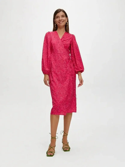 Vibrant pink Confetti Bloom Midi Dress in a wrap silhouette, perfect for weddings and summer parties.