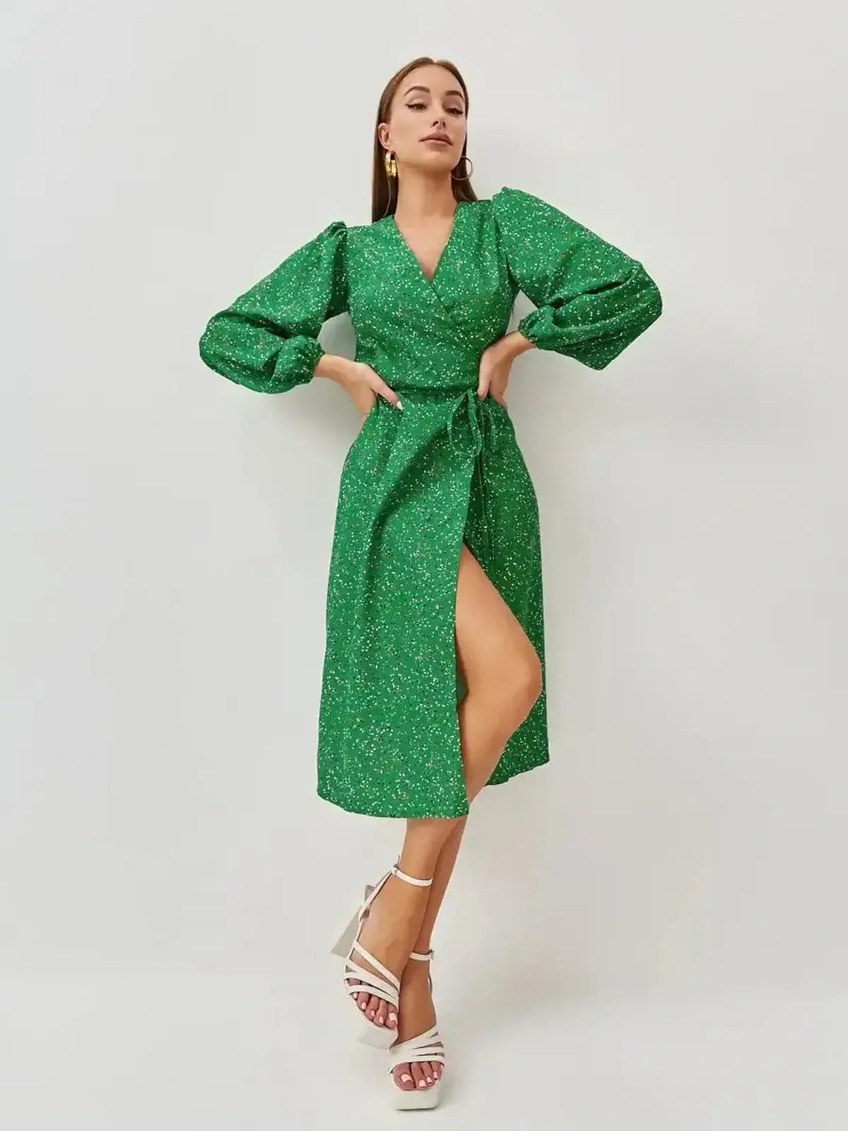 Elegant green midi dress with wrap design and puff sleeves, perfect for weddings and formal events.