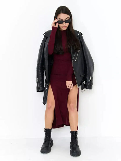 Model wearing a burgundy Velvet Edge Midi Dress with slits, paired with a black leather jacket and sunglasses.