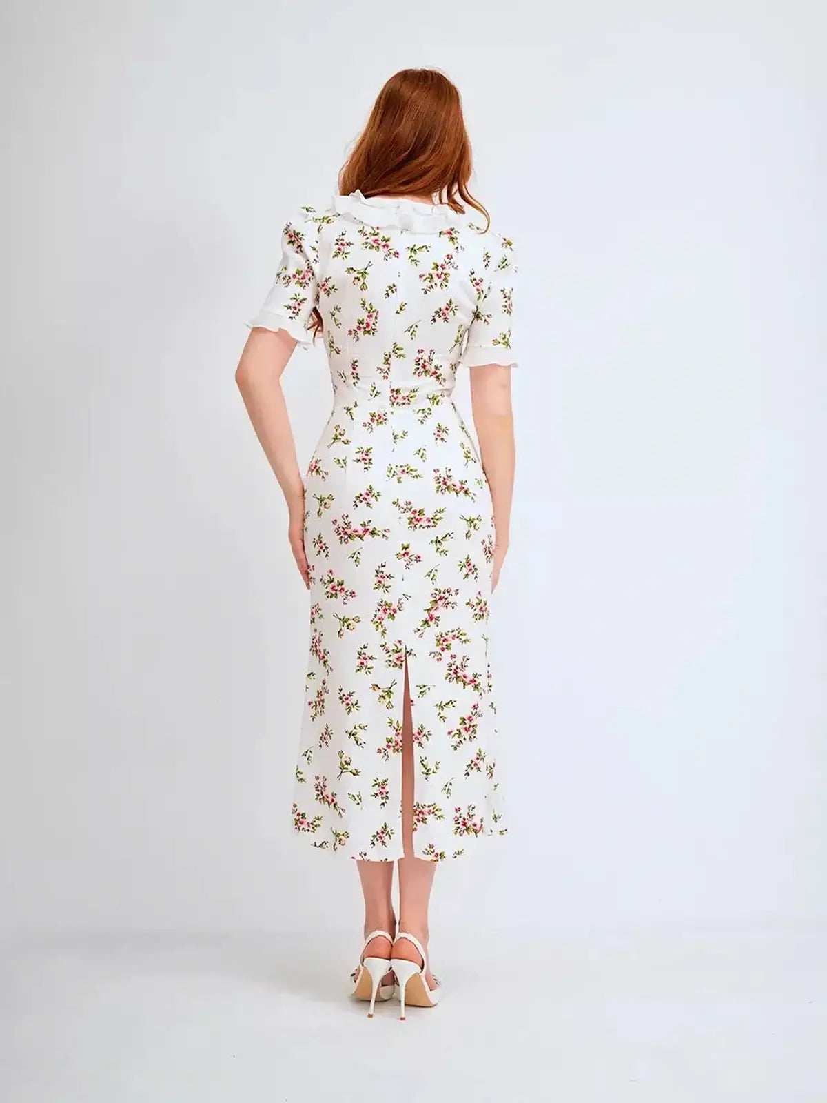 Back view of Roselle Midi Dress featuring floral print and ruffle collar, perfect for summer weddings and formal occasions.