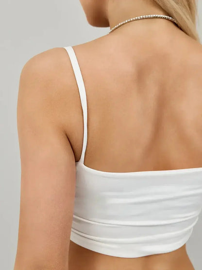 Ruched white crop top back view featuring delicate straps, perfect for summer dresses and cocktail attire.