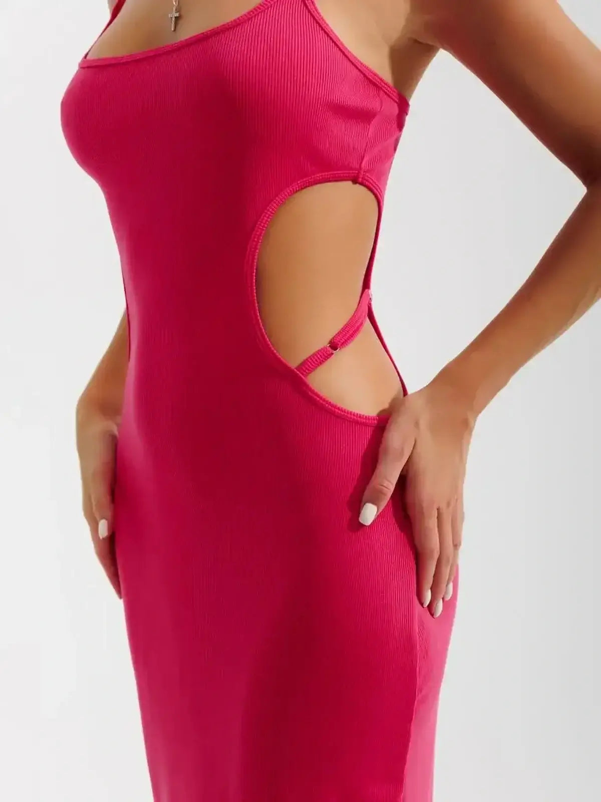 Close-up of a pink Sculpt Midi Dress showcasing side cutouts and a body-hugging fit, perfect for summer events.