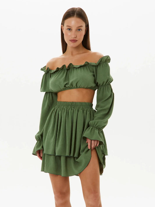 Elegant tiered ruffle set featuring off-shoulder crop top and flowy double-tiered skirt in lightweight khaki fabric.