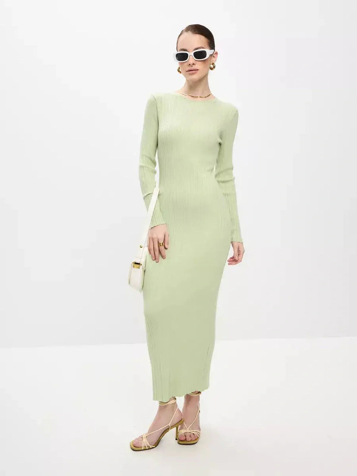 Celery Luxe Maxi Dress in light green ribbed knit, perfect for weddings, prom, or formal occasions, showcasing seamless elegance.