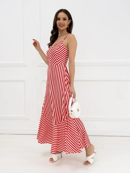 Model wearing a red-and-white striped maxi dress with a tiered hem, ideal for summer events and weddings.