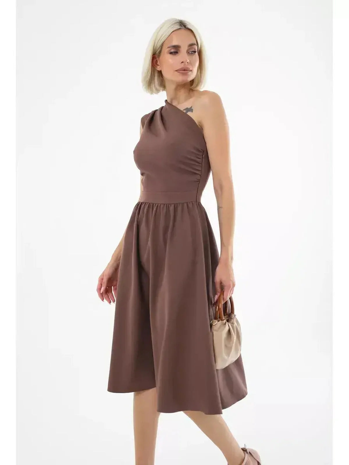 Model wearing a chocolate brown Solace Midi Dress with one-shoulder design, perfect for weddings and summer events.