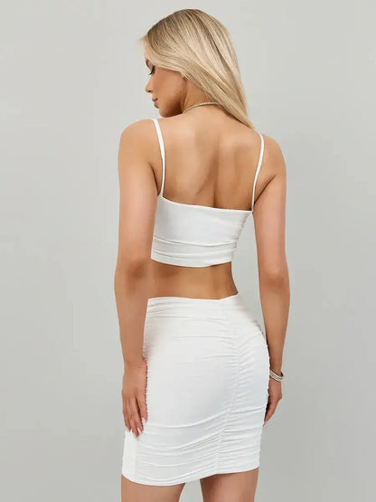 Back view of the Ivory Rush Set, featuring a ruched white crop top and bodycon mini skirt, perfect for summer events.