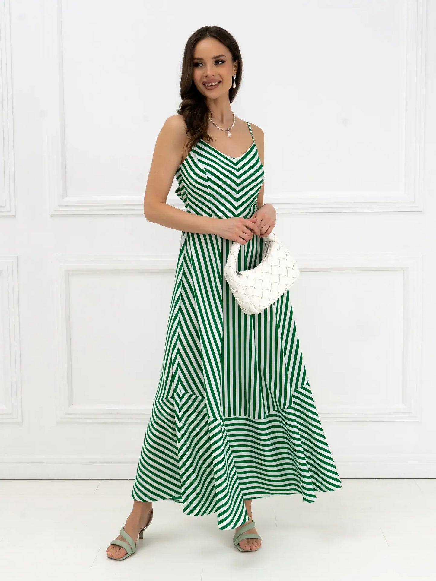 Verde Vibe Maxi Dress in green and white stripes with bow back detail, perfect for summer or semi-formal occasions.