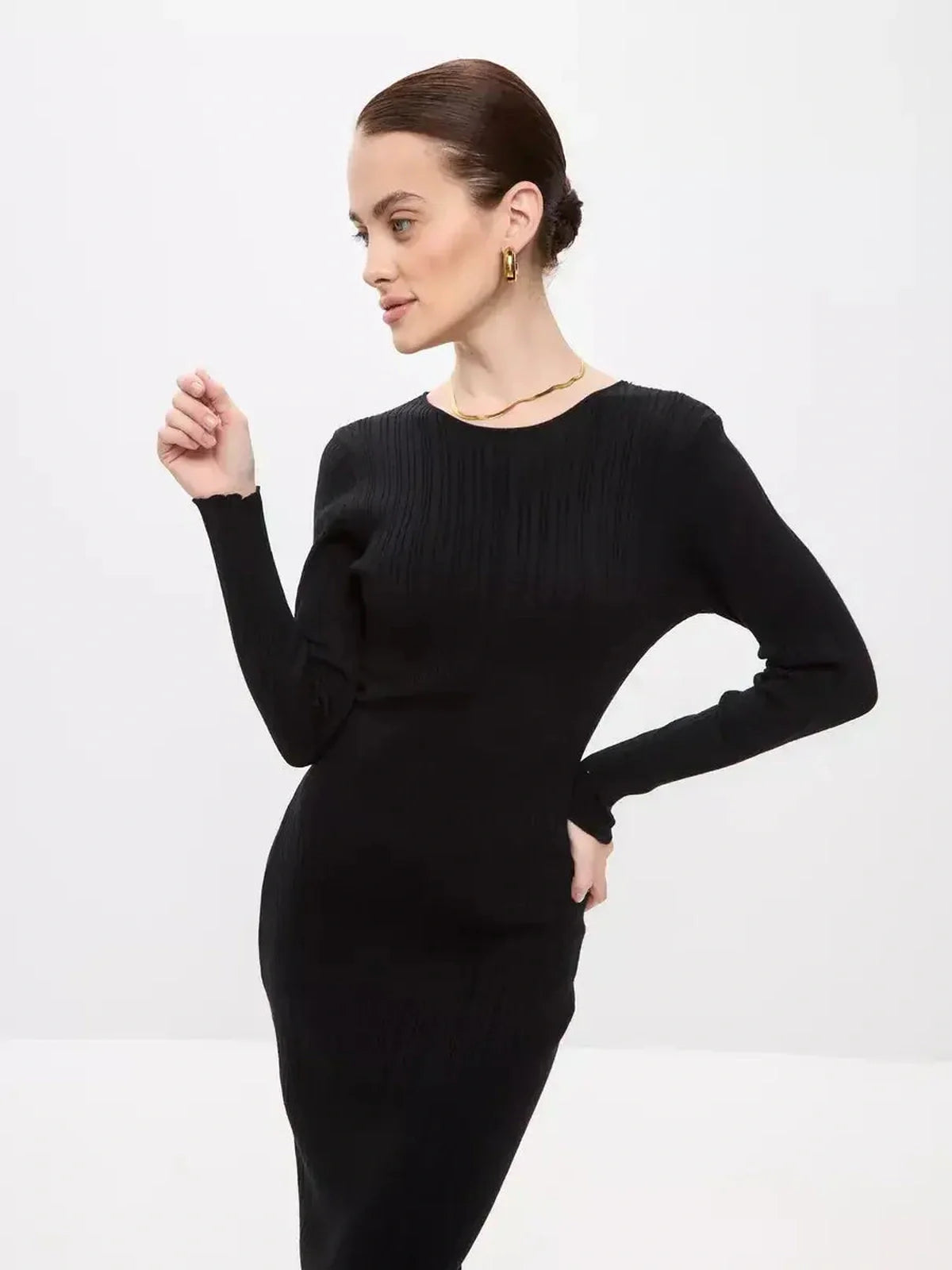 Elegant model showcasing a Sculpted Rib Maxi Dress in black, perfect for weddings, formal occasions, and refined styling.
