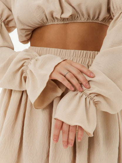 Close-up of Ruffle Breeze Set showing off-shoulder crop top and tiered skirt details, perfect for summer dresses and weddings.