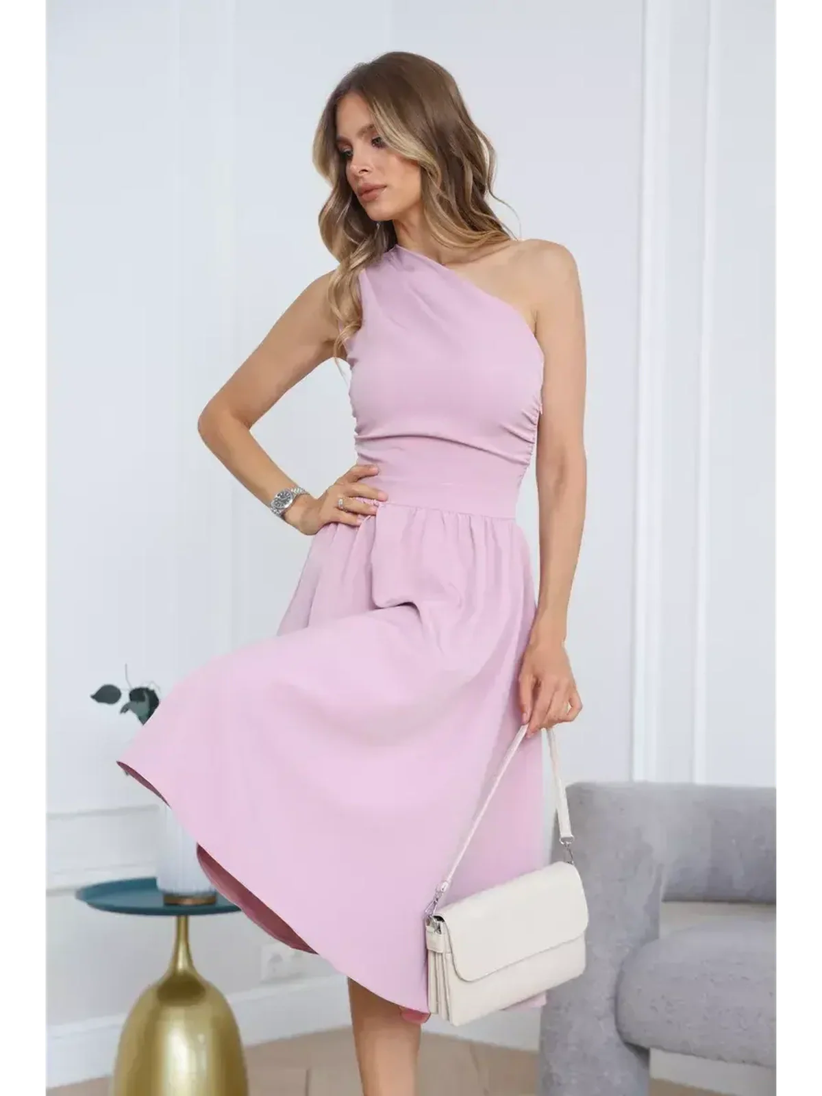 Elegant blush midi dress with one-shoulder design, perfect for weddings and upscale events.