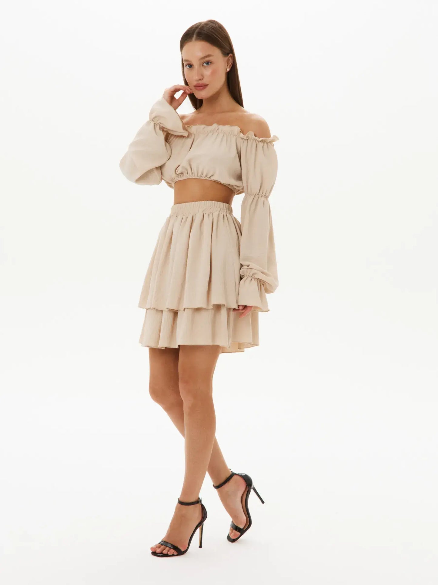 Ruffle Breeze Set featuring an off-shoulder crop top and tiered skirt, perfect for summer weddings and casual outings.