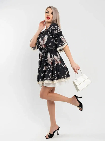 Black Crane Bloom mini dress with floral print, perfect for weddings, proms, and summer events. Stylish and flattering.