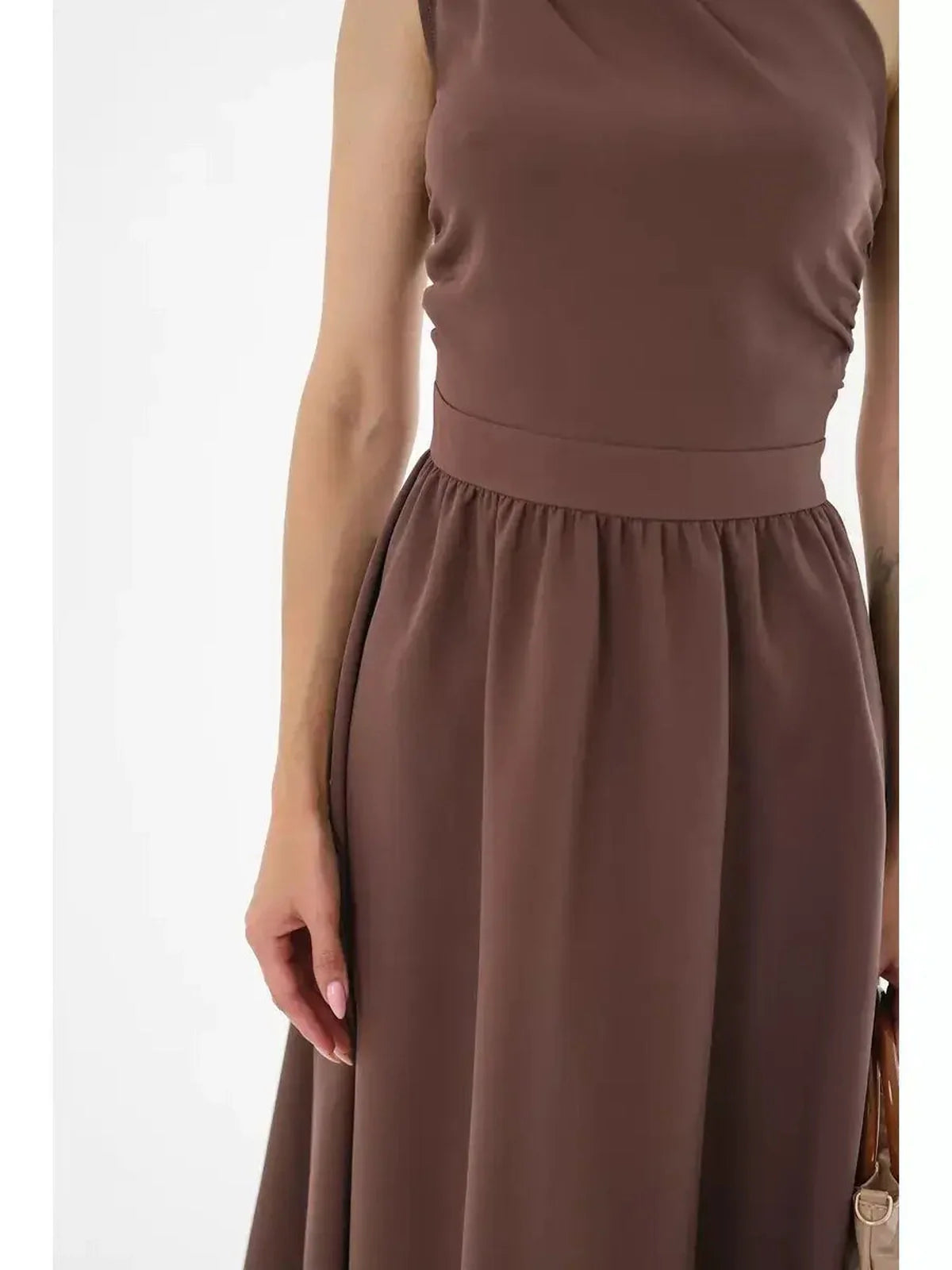 Close-up of the Solace Midi Dress in chocolate brown featuring a one-shoulder design and gathered skirt for elegant style.