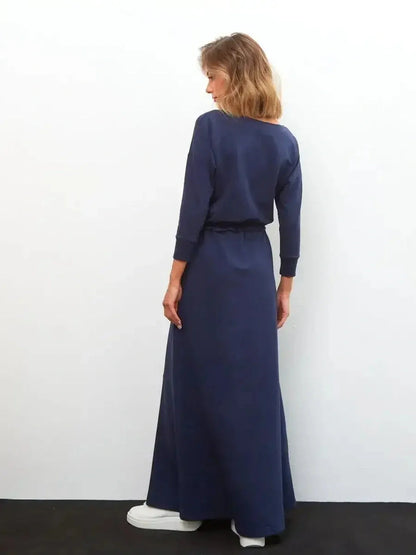Celeste Maxi Dress in navy blue, featuring long sleeves and a relaxed fit, ideal for wedding guest or formal occasions.