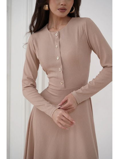 Elegant sculpted midi dress in smooth beige ribbed knit with gold-tone buttons, perfect for formal and casual occasions.