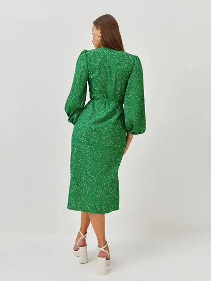 Elegant green midi dress with puff sleeves and speckled dot print, perfect for weddings and summer events.