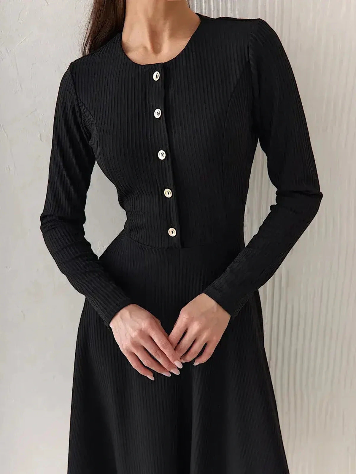 Serene Grace Midi Dress in black ribbed texture with decorative buttons, ideal for formal and casual occasions.