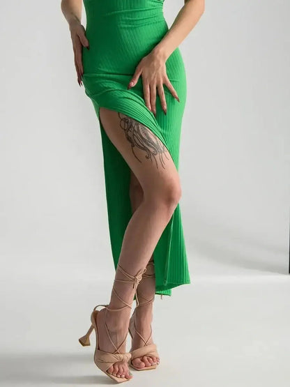 Elegant Maxi Dress Emerald Whisper in vibrant green with a dramatic side slit, perfect for summer events and weddings.