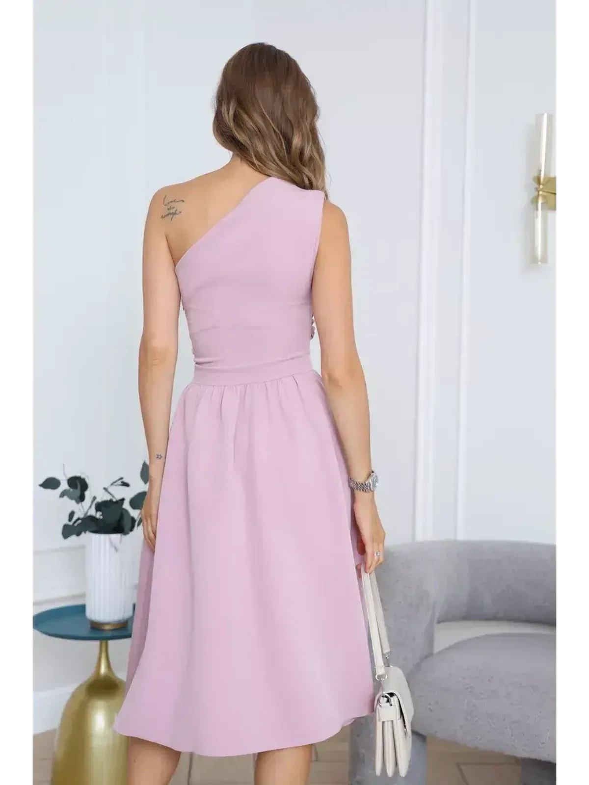 Blush Grace Midi Dress showcased from the back, featuring an elegant one-shoulder design and flowing A-line skirt.