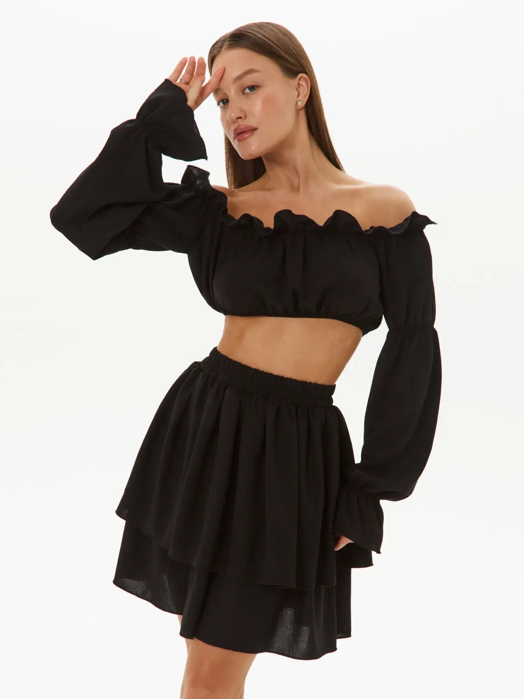 Ruffle Muse Set black off-shoulder crop top and tiered mini skirt, perfect for cocktail and summer dresses.