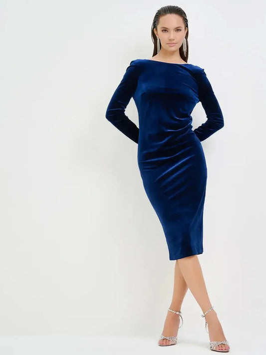 Elegant velvet obsidian midi dress in deep navy perfect for wedding guest, formal occasions, and cocktail events.