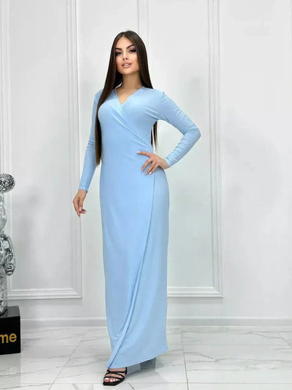 Celeste Charm Maxi Dress in light blue, featuring a wrap silhouette and long sleeves, perfect for summer weddings and formal events.