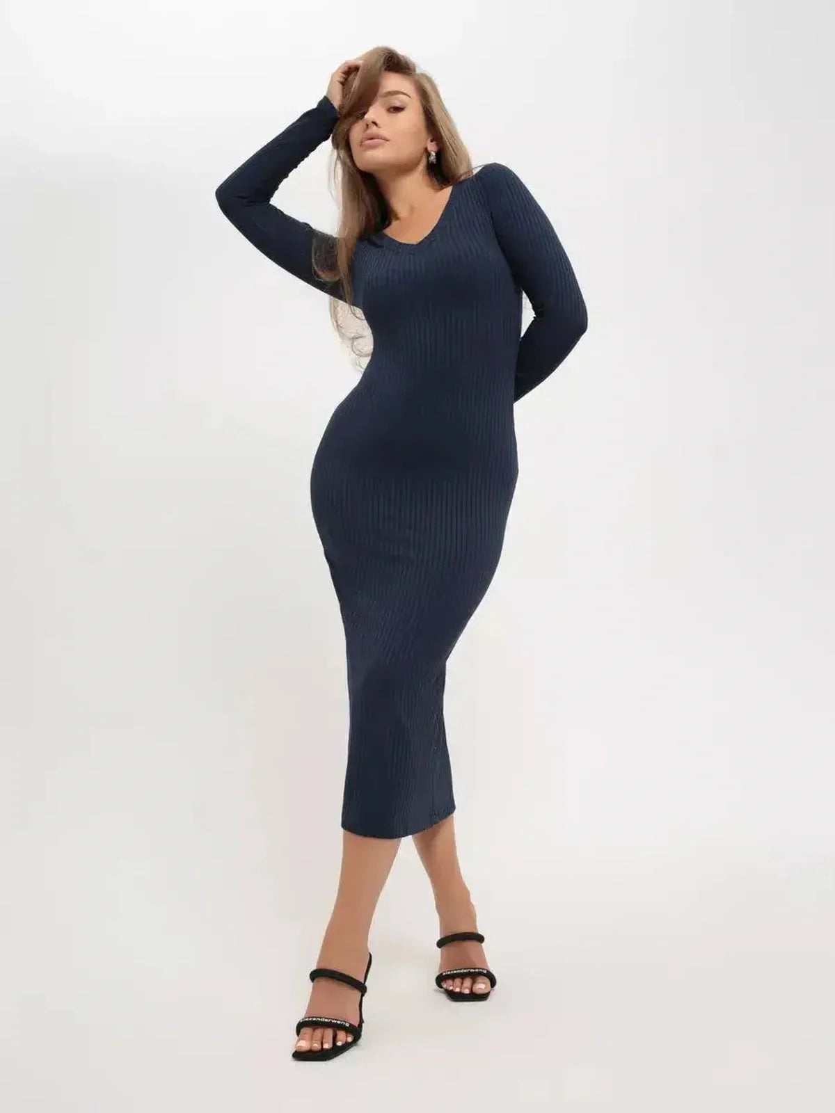 Contour Midi Dress in dark navy ribbed knit featuring long sleeves and a V-neckline, perfect for elegant occasions.
