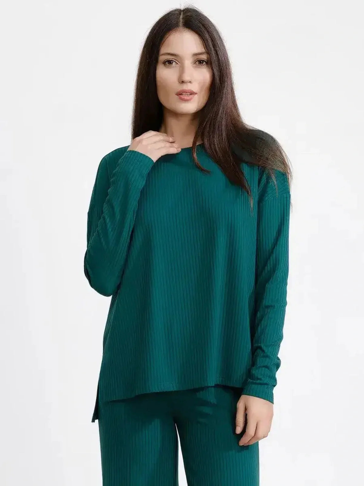 Model in a dark green LoungeEase Set featuring a relaxed fit ribbed top and matching wide-leg pants for stylish comfort.