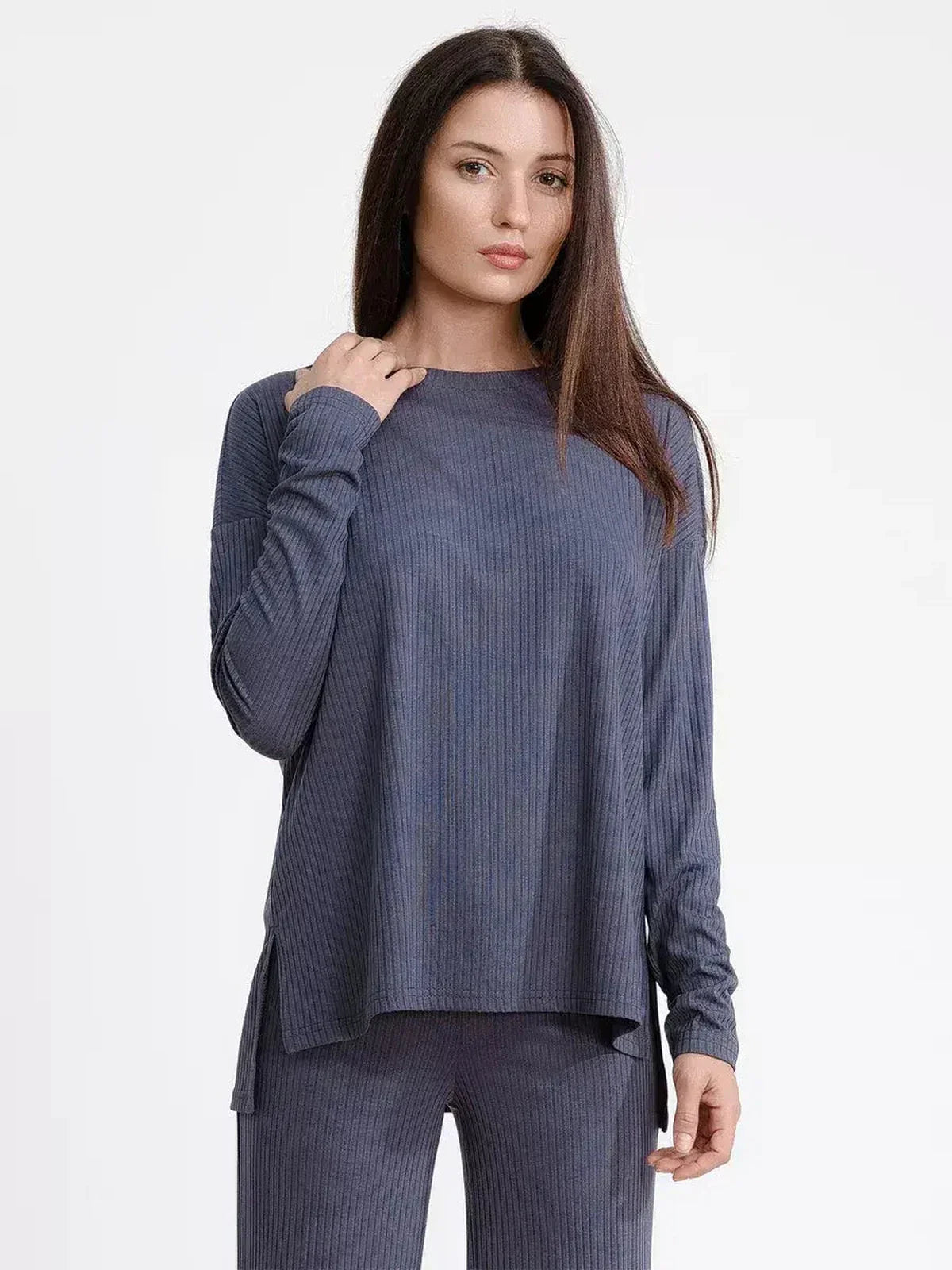 Model wearing a cozy oversized slate lounge set, featuring a long-sleeve top and matching wide-leg pants.
