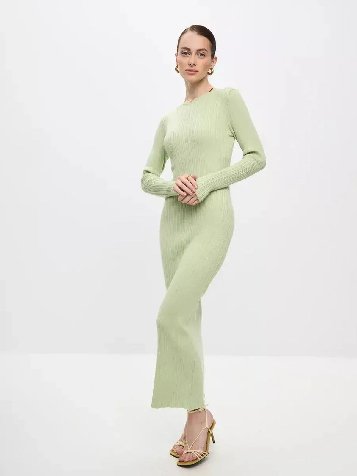 Celery Luxe Maxi Dress in light green, showcasing a sculpted ribbed fit for summer and formal occasions.