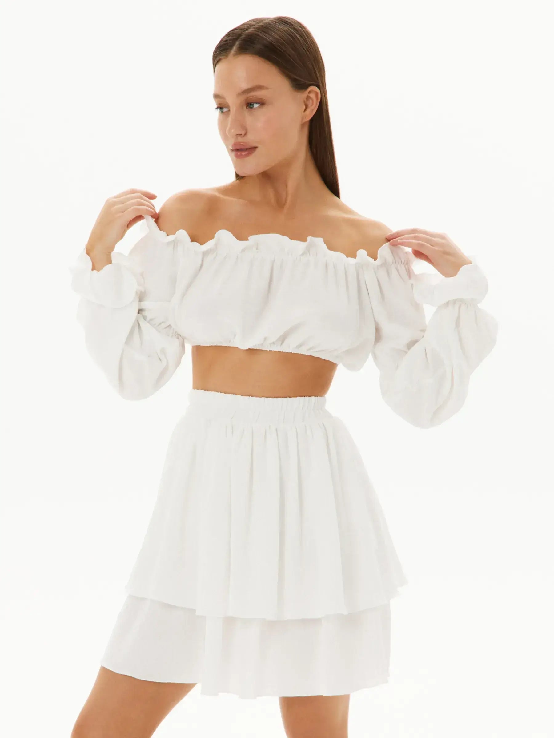 White Ruffle Set featuring off-shoulder top and layered mini skirt, perfect for summer events and weddings.