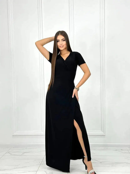Obsidian Grace Maxi Dress in black with elegant wrap silhouette and side slit, perfect for weddings and summer evenings.
