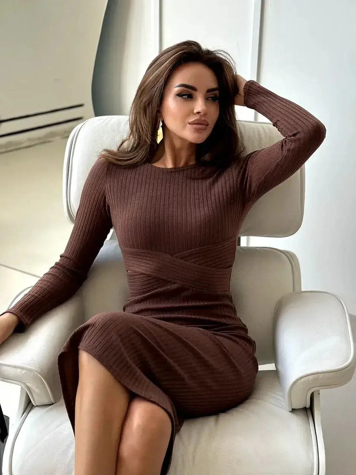 Elegant brown Sculptura Midi Dress featuring sculpted ribbed knit fabric and flattering waist detail, ideal for formal occasions.