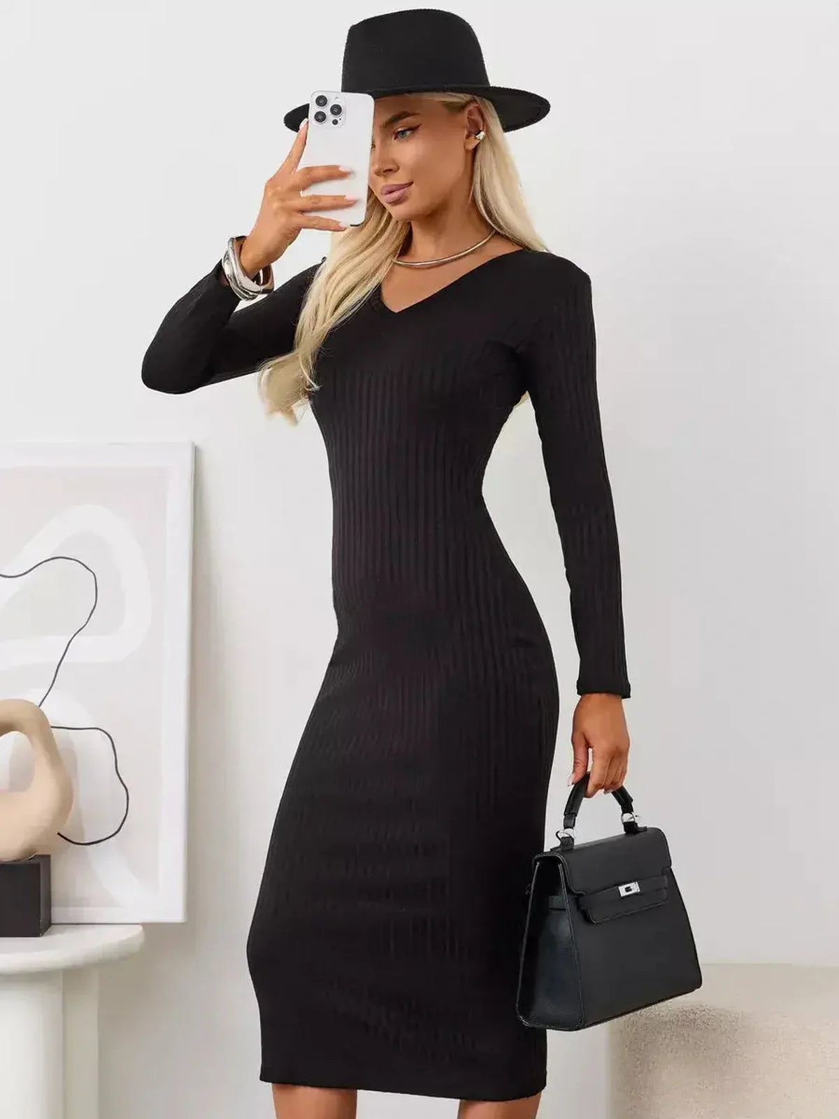 Sleek black Muse Midi Dress with V-neckline and long sleeves, perfect for weddings, formal events, and modern women's fashion.