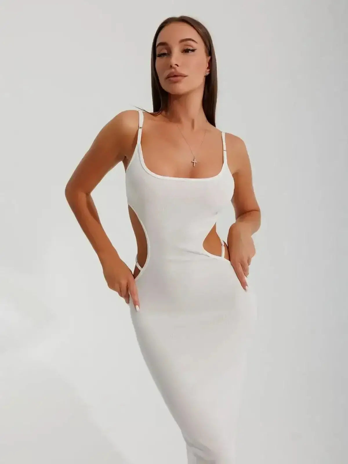 Sleek white midi dress with alluring side cutouts, perfect for formal events, cocktail parties, and summer gatherings.