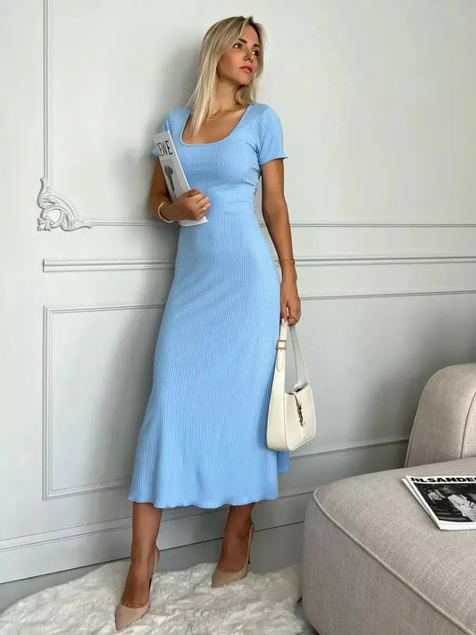 Serene Lines Midi Dress in soft ribbed knit, elegant sky blue color, ideal for summer weddings and casual events.
